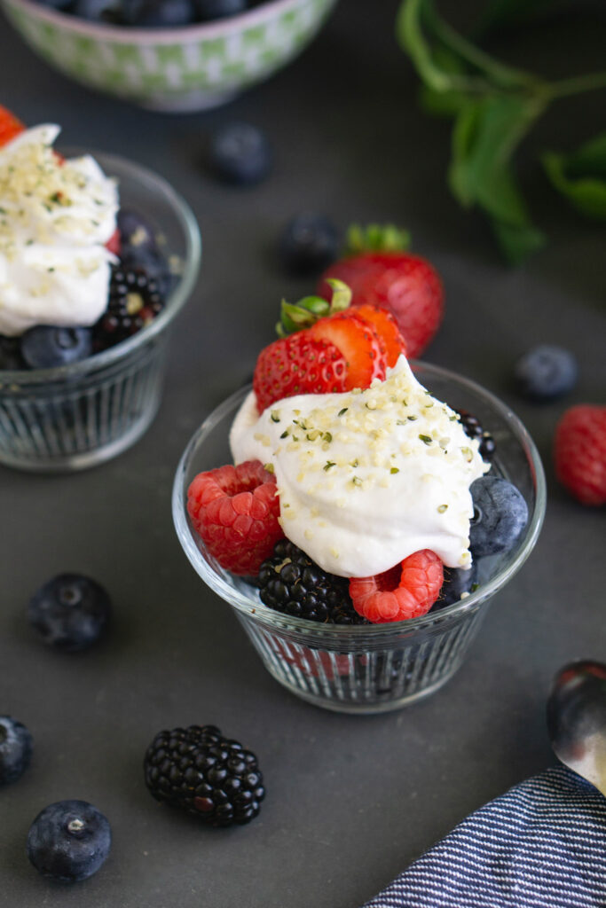 Assorted berries with coconut whipped cream